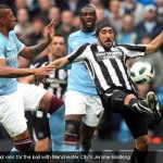 Jonas Gutierrez vies for the ball with Manchester City's Jerome Boateng Jonas Gutierrez vies for the ball with Manchester City's Jerome Boateng