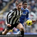 Andy Carroll vies for the ball with Chelsea's John Obi Mikel