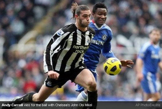 Andy Carroll vies for the ball with Chelsea's John Obi Mikel
