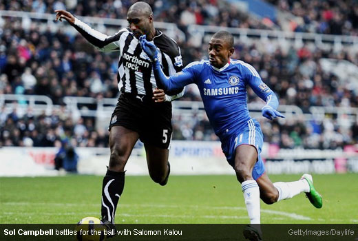 Sol Campbell battles for the ball with Salomon Kalou