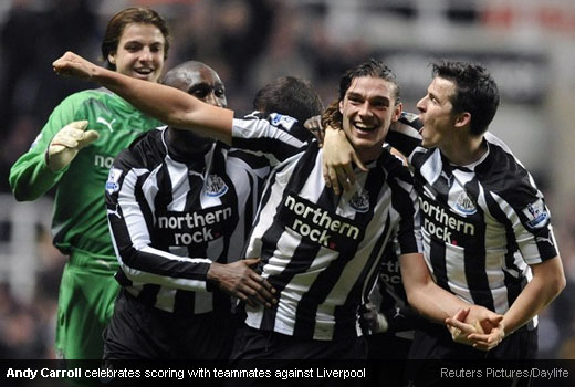 Andy Carroll celebrates scoring with teammates against Liverpool