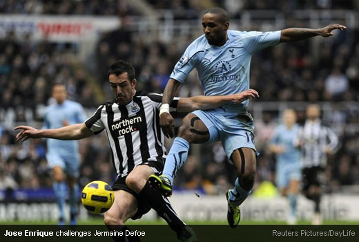 Jose Enrique challenges Jermaine Defoe to the ball