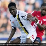 Modibo Maiga (L) keeping the ball away from Lille's Cameroonian midfielder Aurelien Chedjou [Magpies Zone/Getty Images/DayLife]