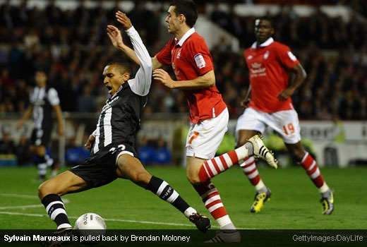 Sylvain Marveaux is pulled back by Brendan Moloney [MagpiesZone/GettyImages/DayLife]