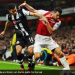 Hatem Ben Arfa and Robin van Persie battle for the ball Hatem Ben Arfa and Robin van Persie battle for the ball