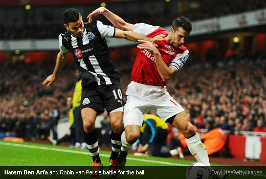 Hatem Ben Arfa and Robin van Persie battle for the ball