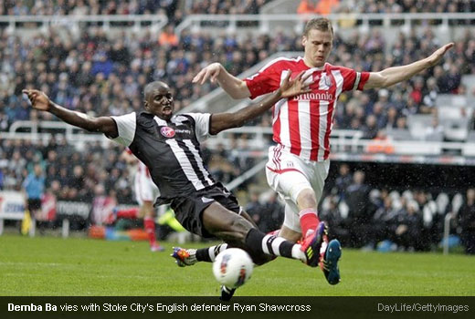 Demba Ba vies with Stoke City's English defender Ryan Shawcross