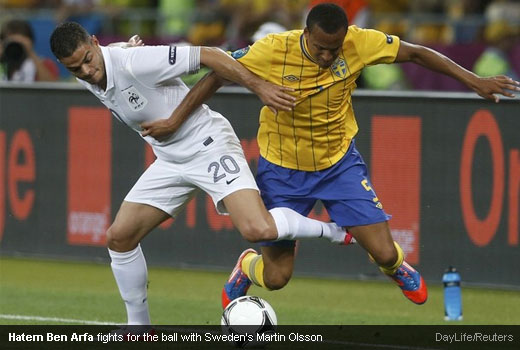 Hatem Ben Arfa fights for the ball with Sweden's Martin Olsson