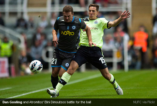 Dan Gosling and Atromitos' Elini Dimoutsos battle for the ball