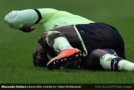 Massadio Haidara injured after a tackle by Callum McManaman